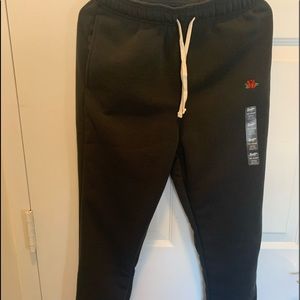 Brand new joggers with the rose logo on left leg